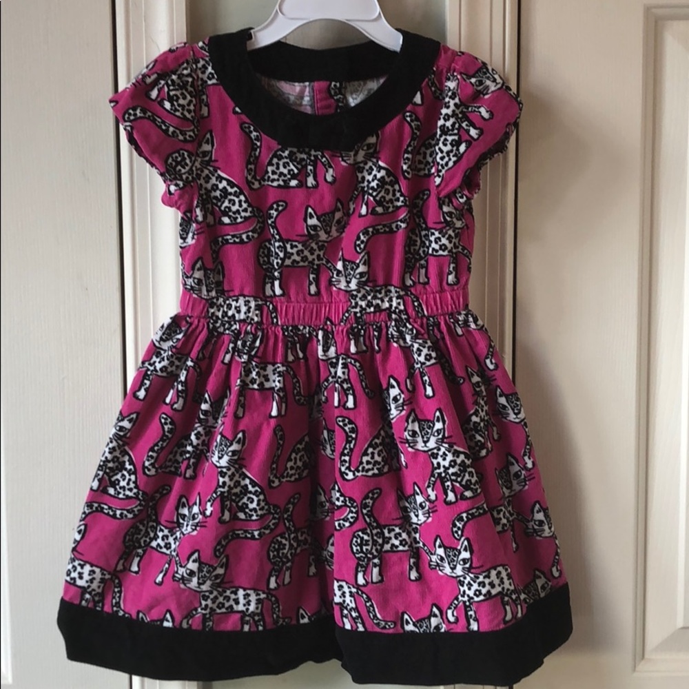 Gently used pink and black corduroy kitten dress.